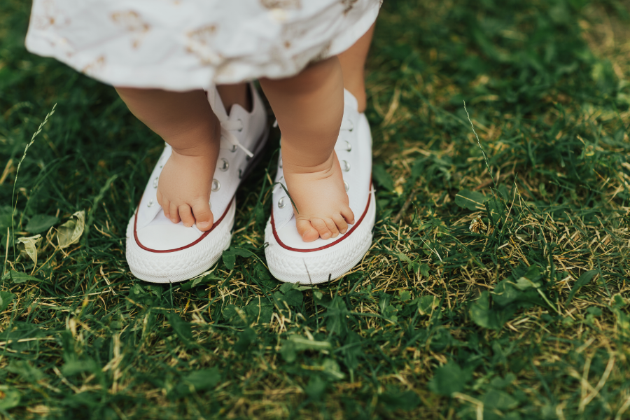 toddler feet on parents